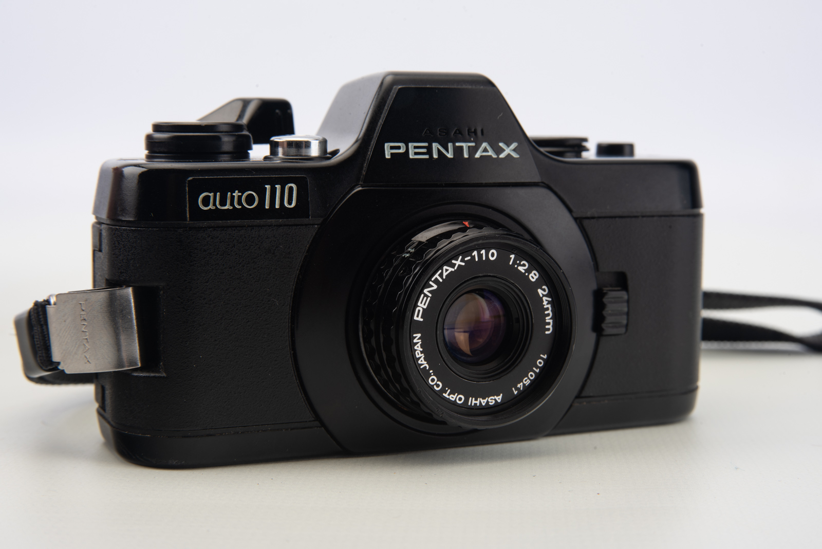 Pentax Auto 110 SLR Film Camera w 24mm f2.8 Lens Cap Wrist Strap