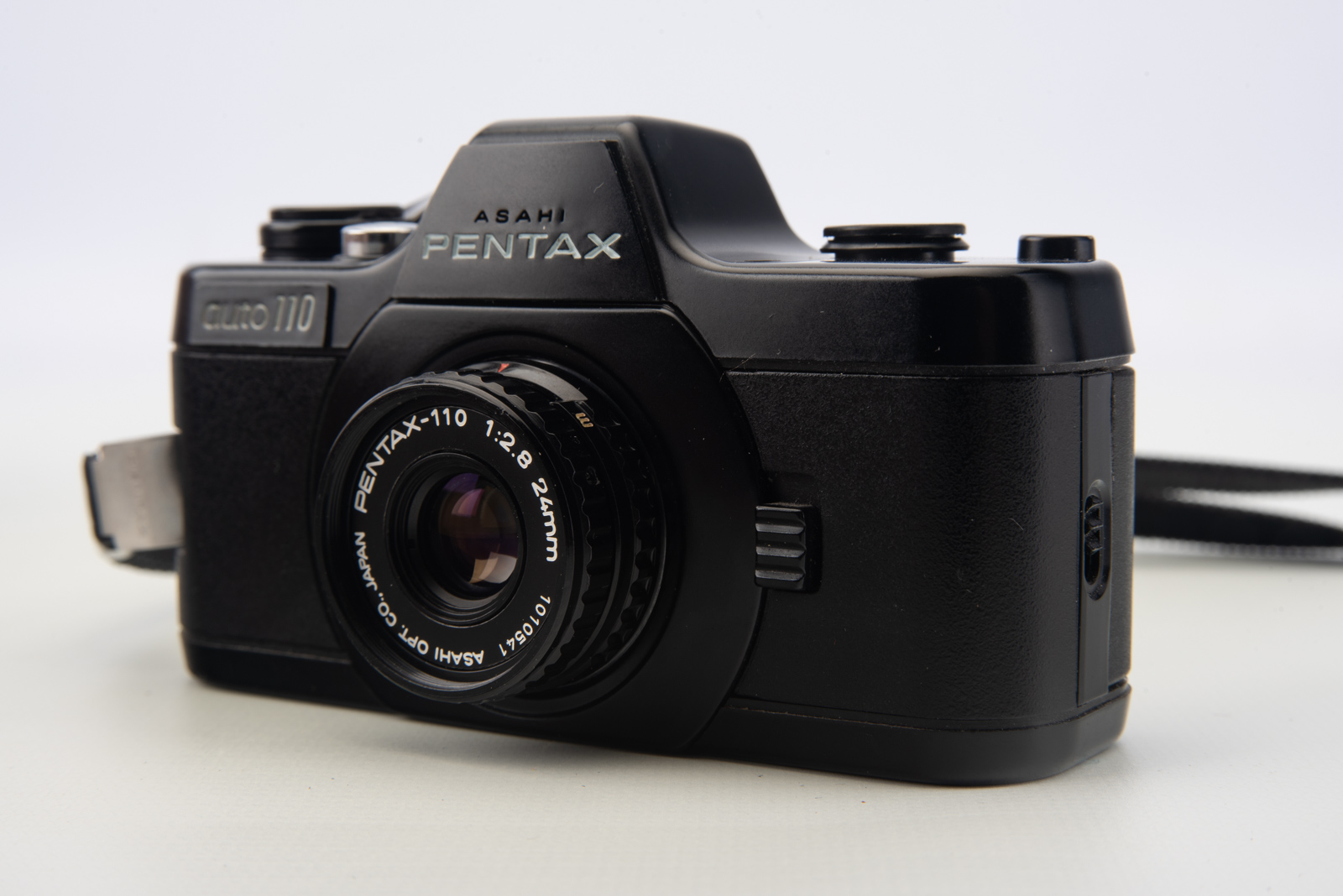 Pentax Auto 110 SLR Film Camera w 24mm f2.8 Lens Cap Wrist Strap